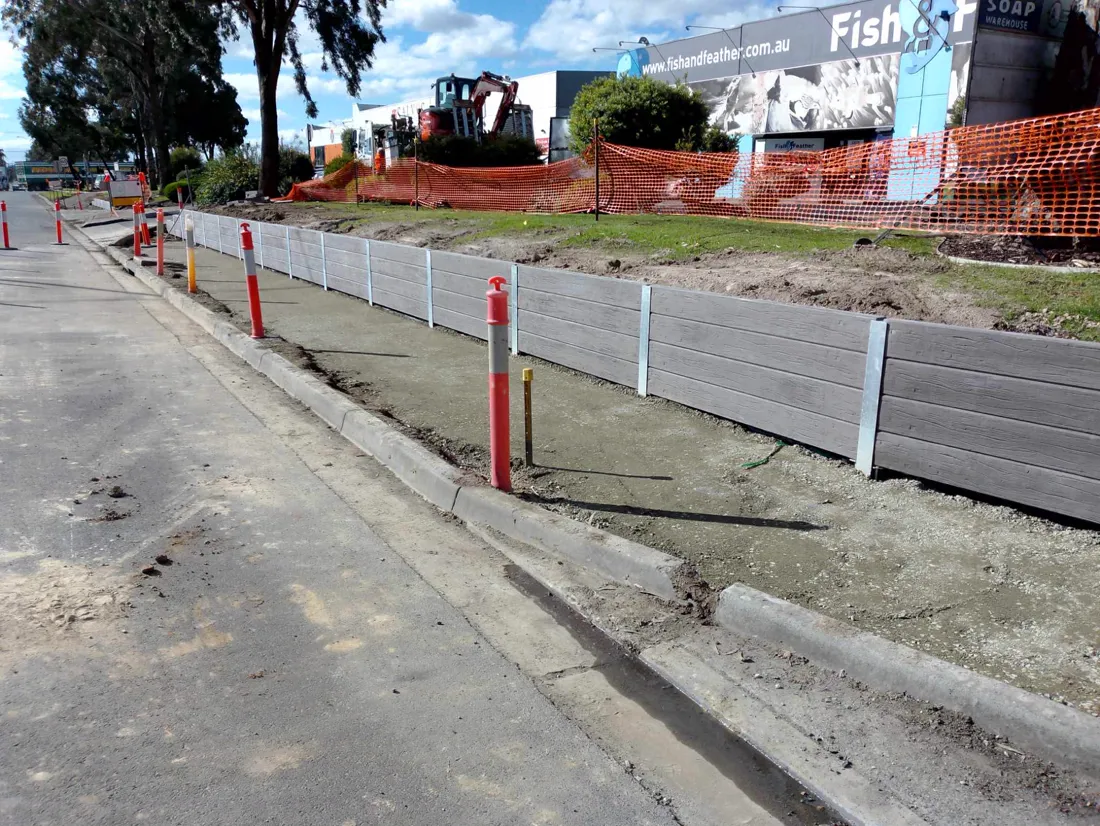 Large grey sleeper retaining wall