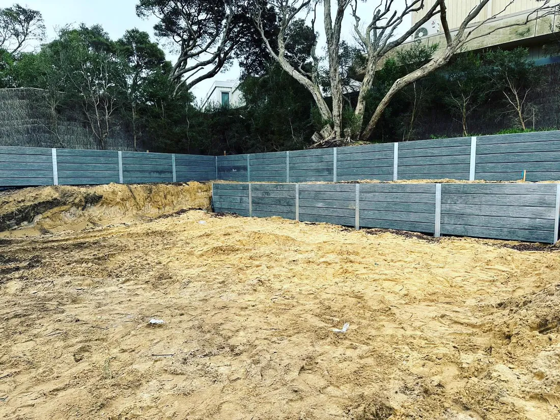 Completed grey sleeper retaining wall