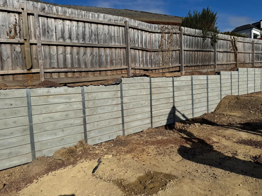 Completed grey sleeper retaining wall