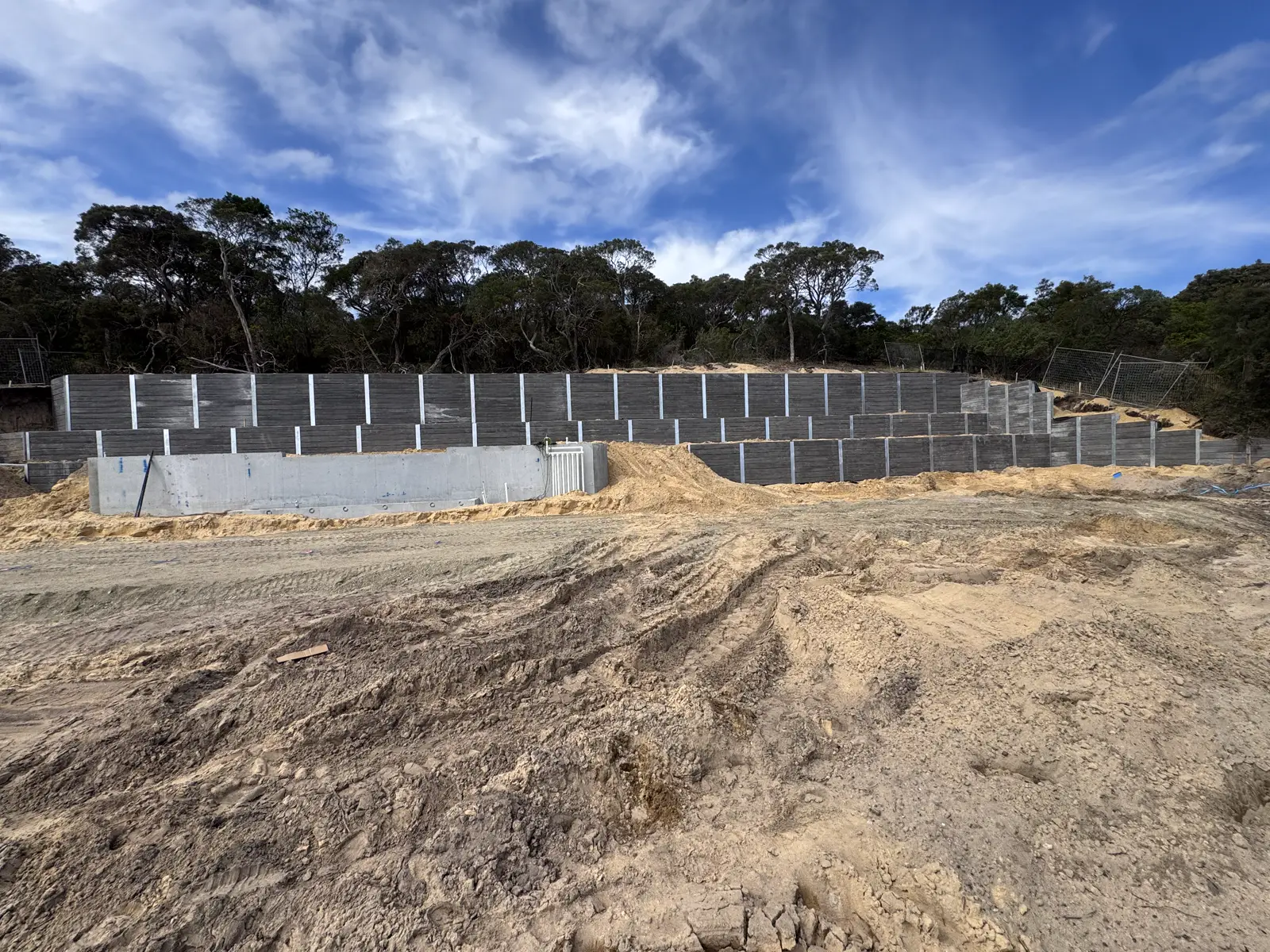Large multi-tier concrete sleeper retaining wall on a civil site by Align Excavation Group