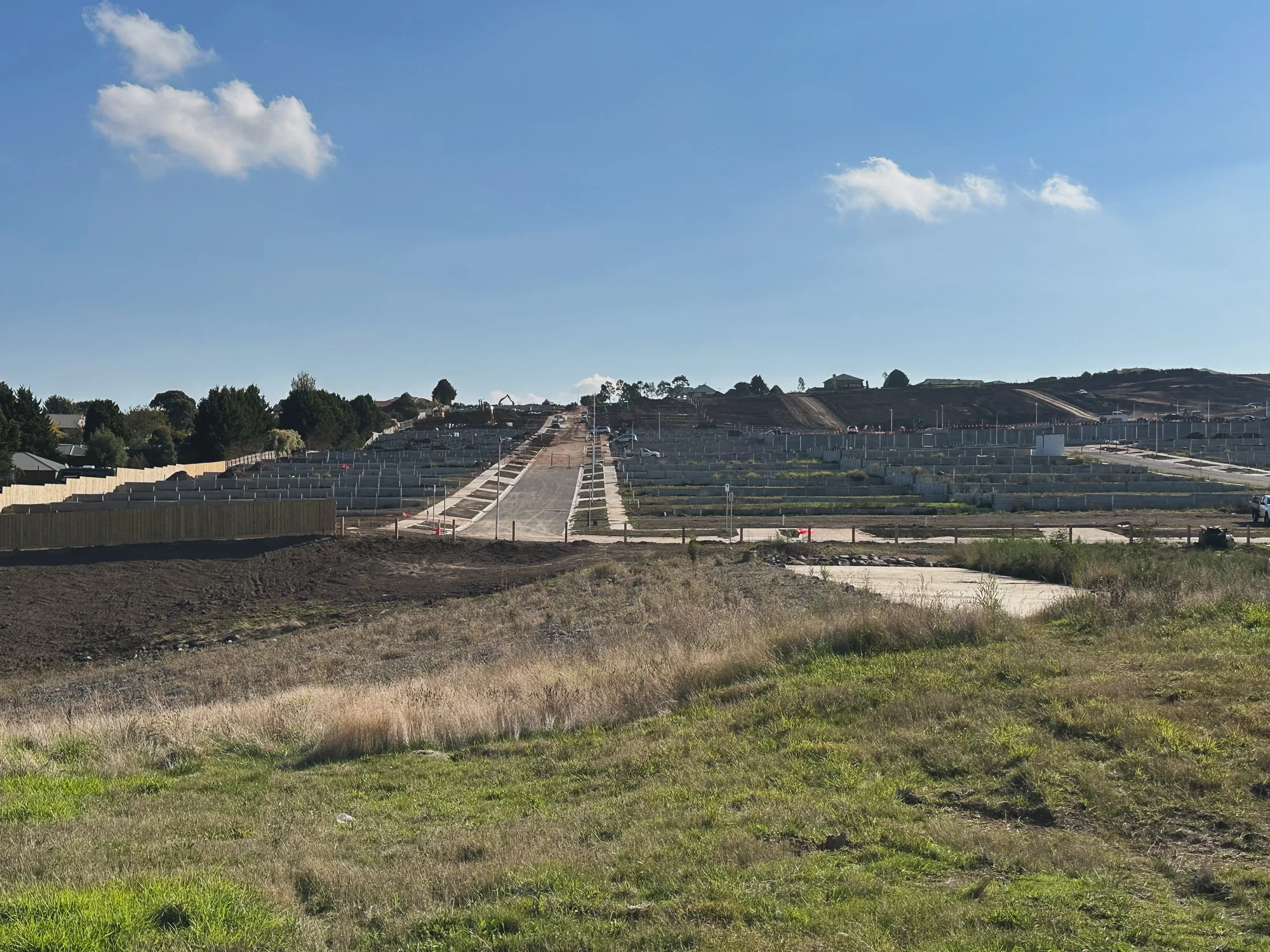 Wide view over a subdivision with long runs of Align retaining wall terracing the site